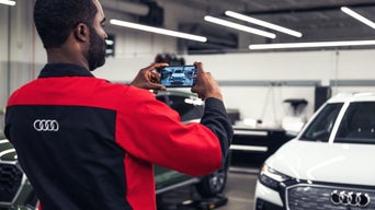 Tech looking at windshield