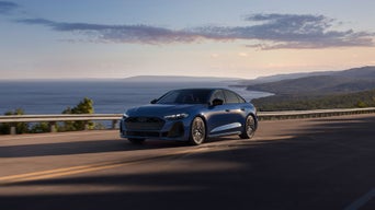 Three-quarter front view of the Audi S5 in motion.