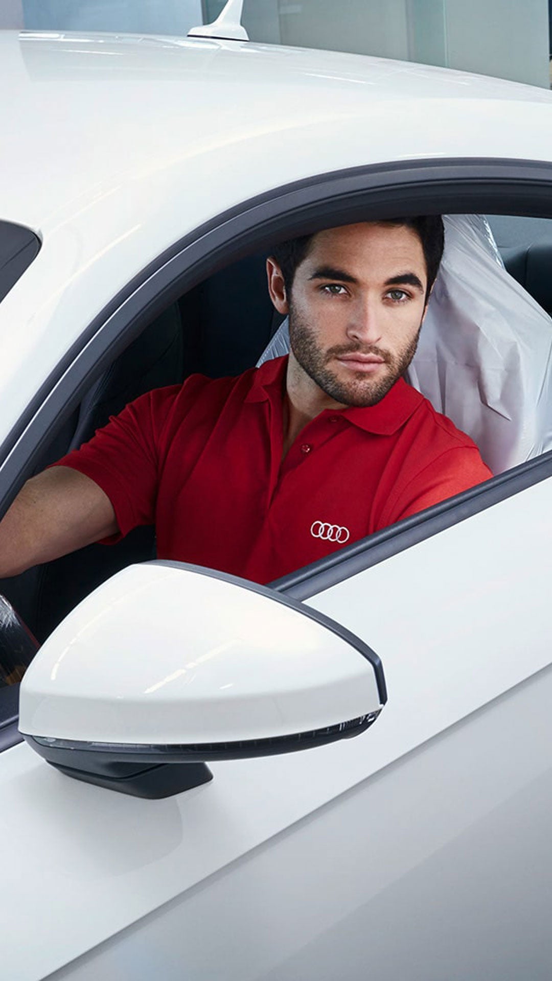 An Audi Technician servicing an Audi vehicle.