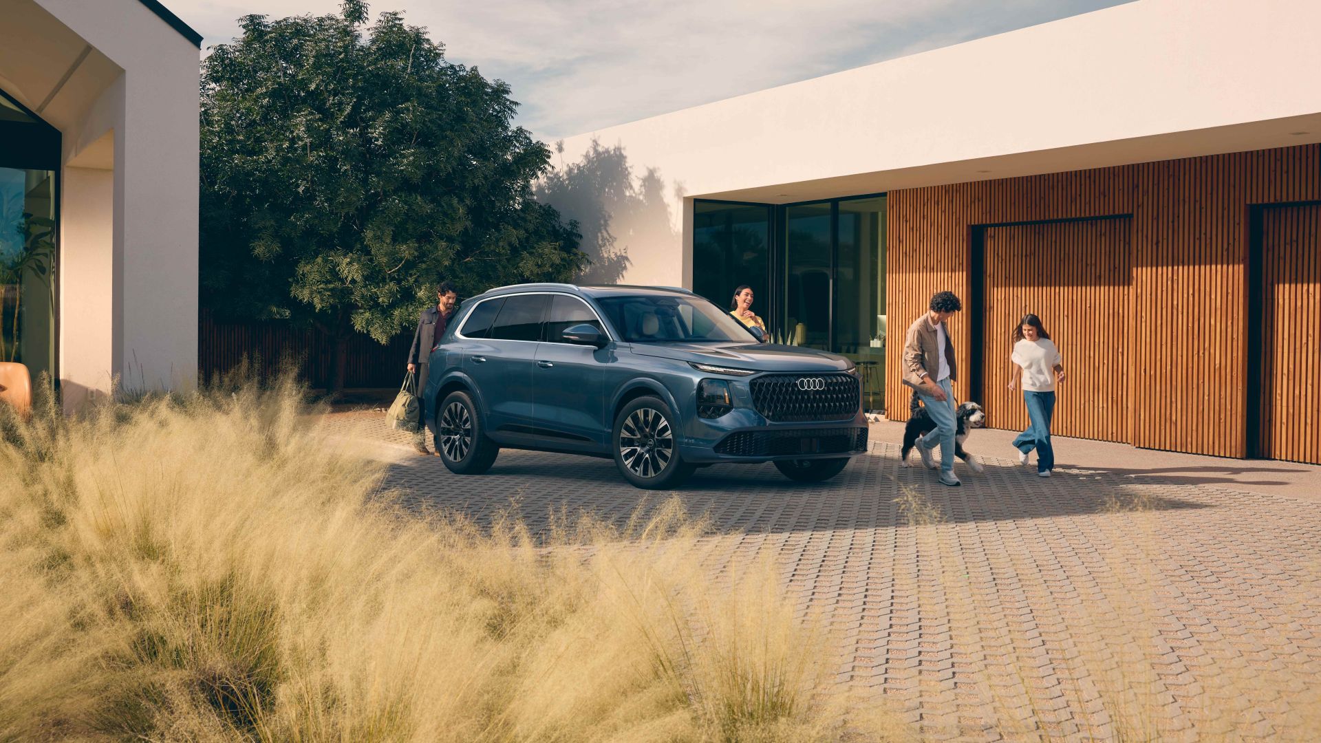 Three quarter view of an Audi Q7 vehicle parked.