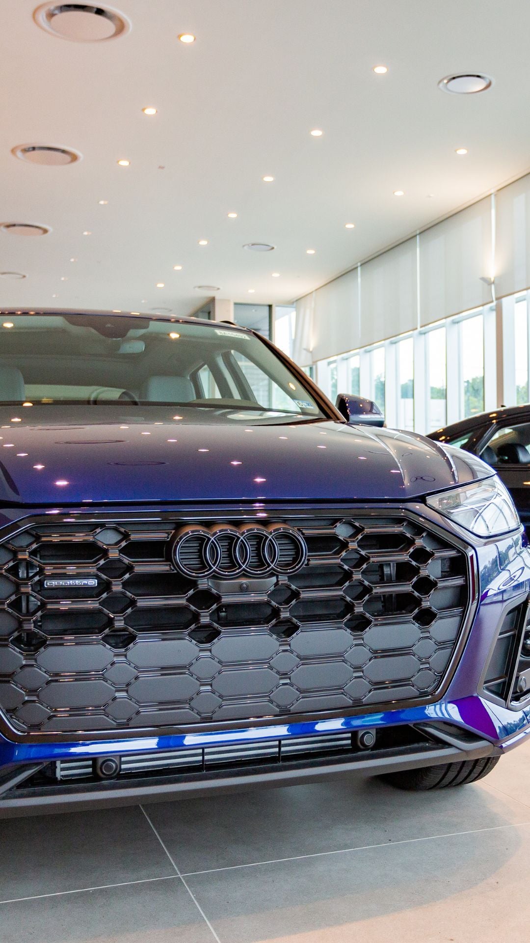 Rear profile view of an Audi Q5 parked.