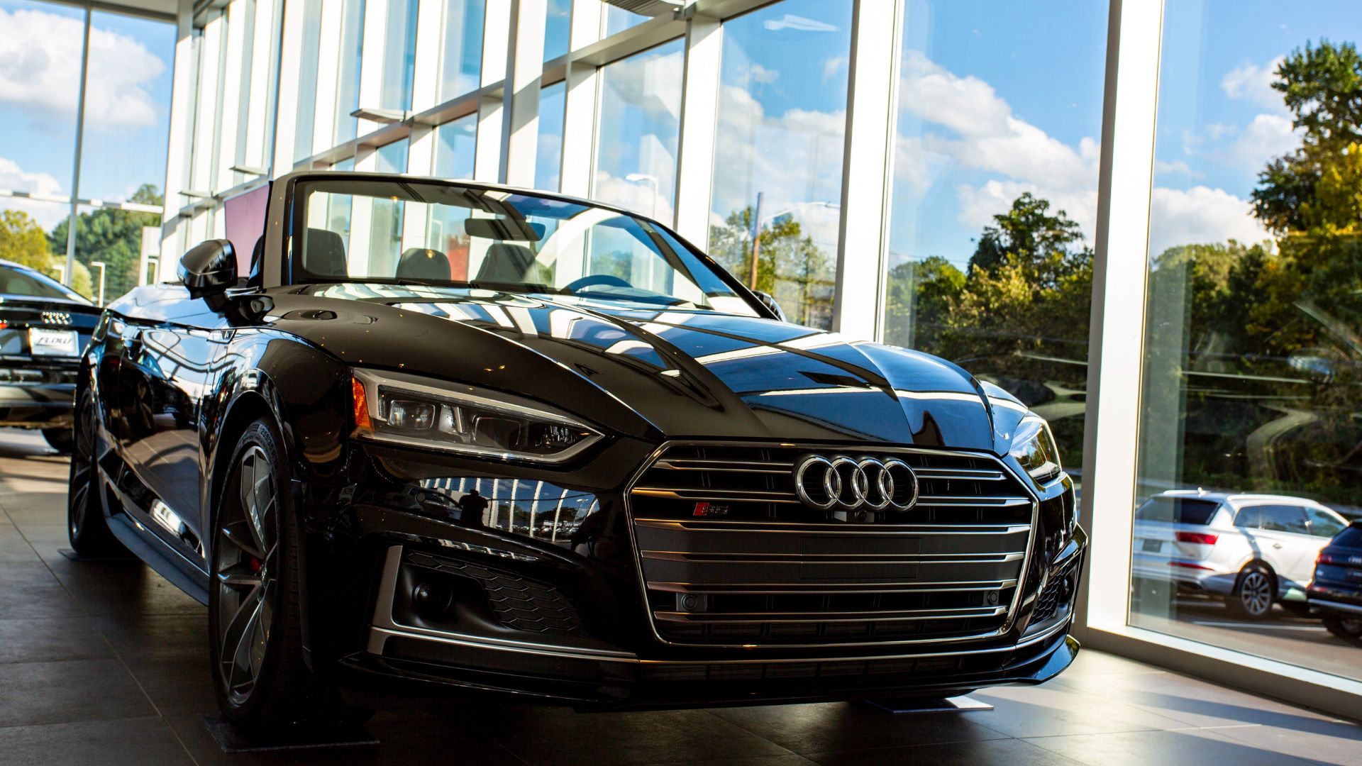 Audi sedan parked inside the Audi Winston-Salem showroom