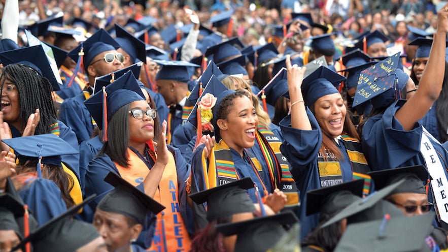 A group of graduates celebrating at a Lincoln University graduation.