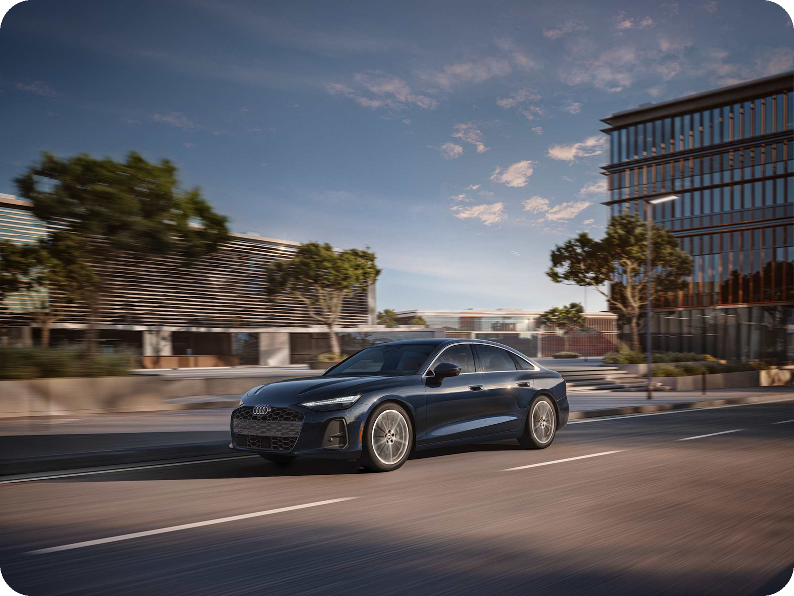 Audi A6 executive sedan driving.