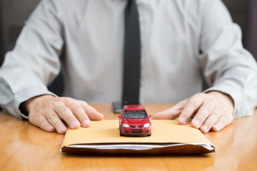 Audi financial team member with car loan documents