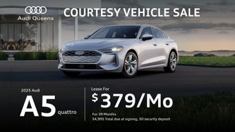 three quarter view of an Audi A5 parked.