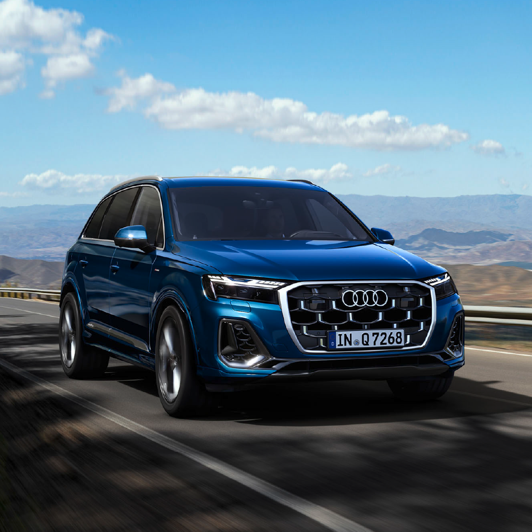 Driving image of the blue Audi Q7 SUV