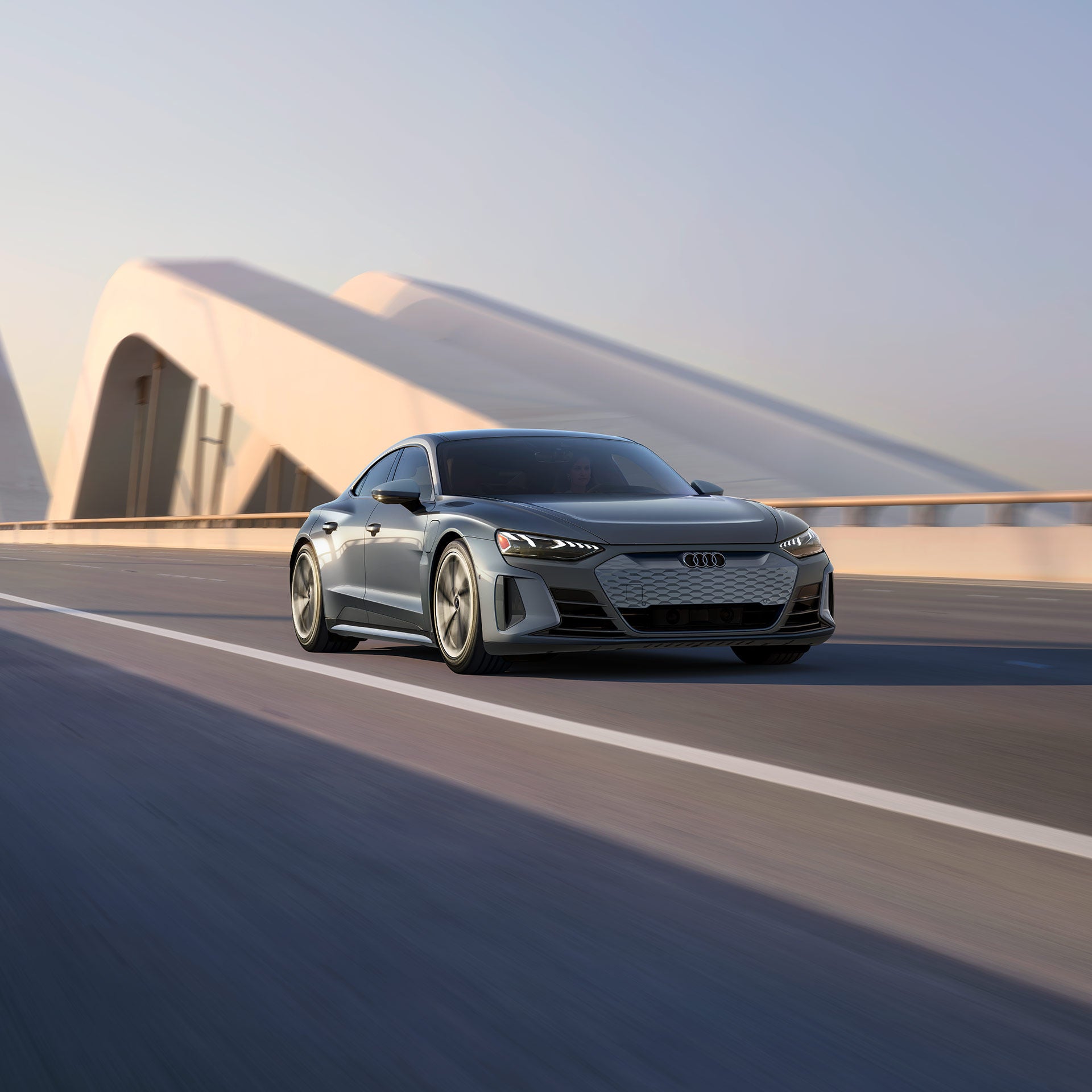 Side profile of the Audi e-tron GT accelerating.