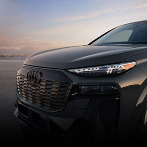 Close-up on the front headlight on the Audi Q6 Sportback e-tron.