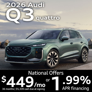Side view of an Audi Q3 driving.