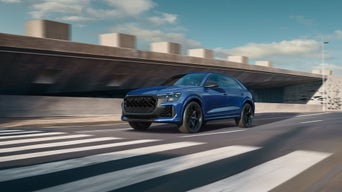 Three-quarter front view of the Audi RS Q8 in motion.
