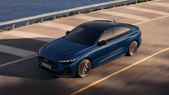 Profile view of Audi vehicle. 