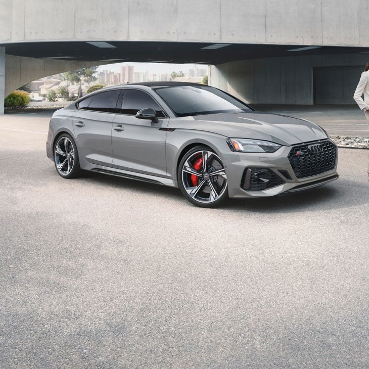 Three-quarter front view of the Audi RS 5 Sportback parked.