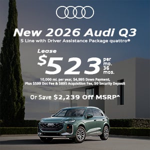 Side view of an Audi Q3 parked.