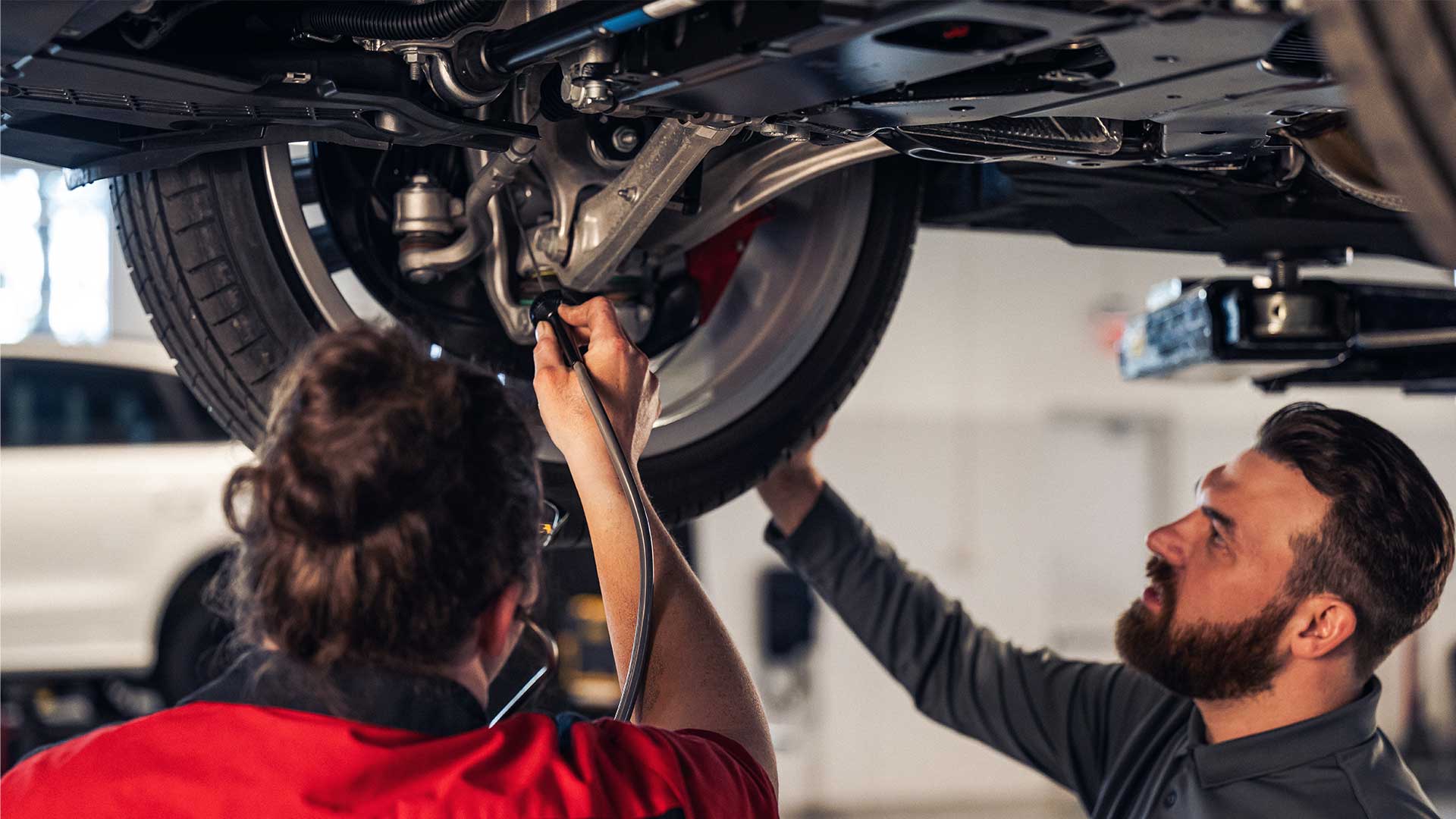 Service technicians serving vehicle