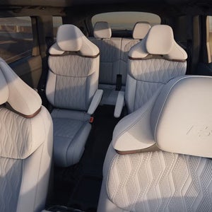 Audi SQ9 six-passenger interior with second-row captain’s chairs and premium leather seating.