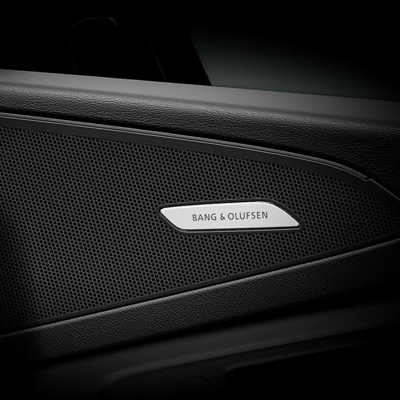 Close-up on a Bang & Olufsen speaker in the Audi Q6 e-tron.