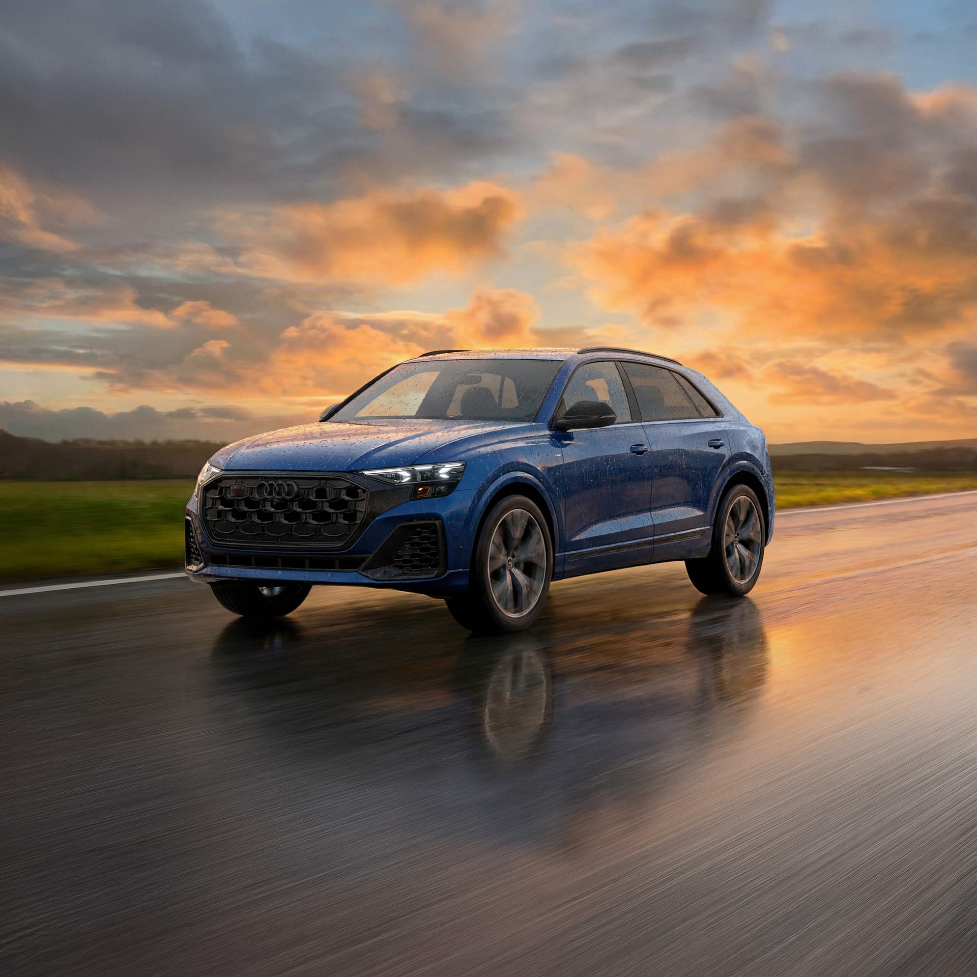 Front profile of the Audi Q4 e-tron accelerating.