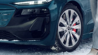 Close up on the tire of an Audi vehicle. 