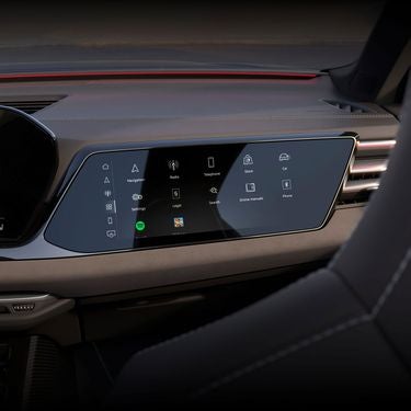 View of the interior cabin of the Audi S5, showing the passenger display screen and the dashboard.
