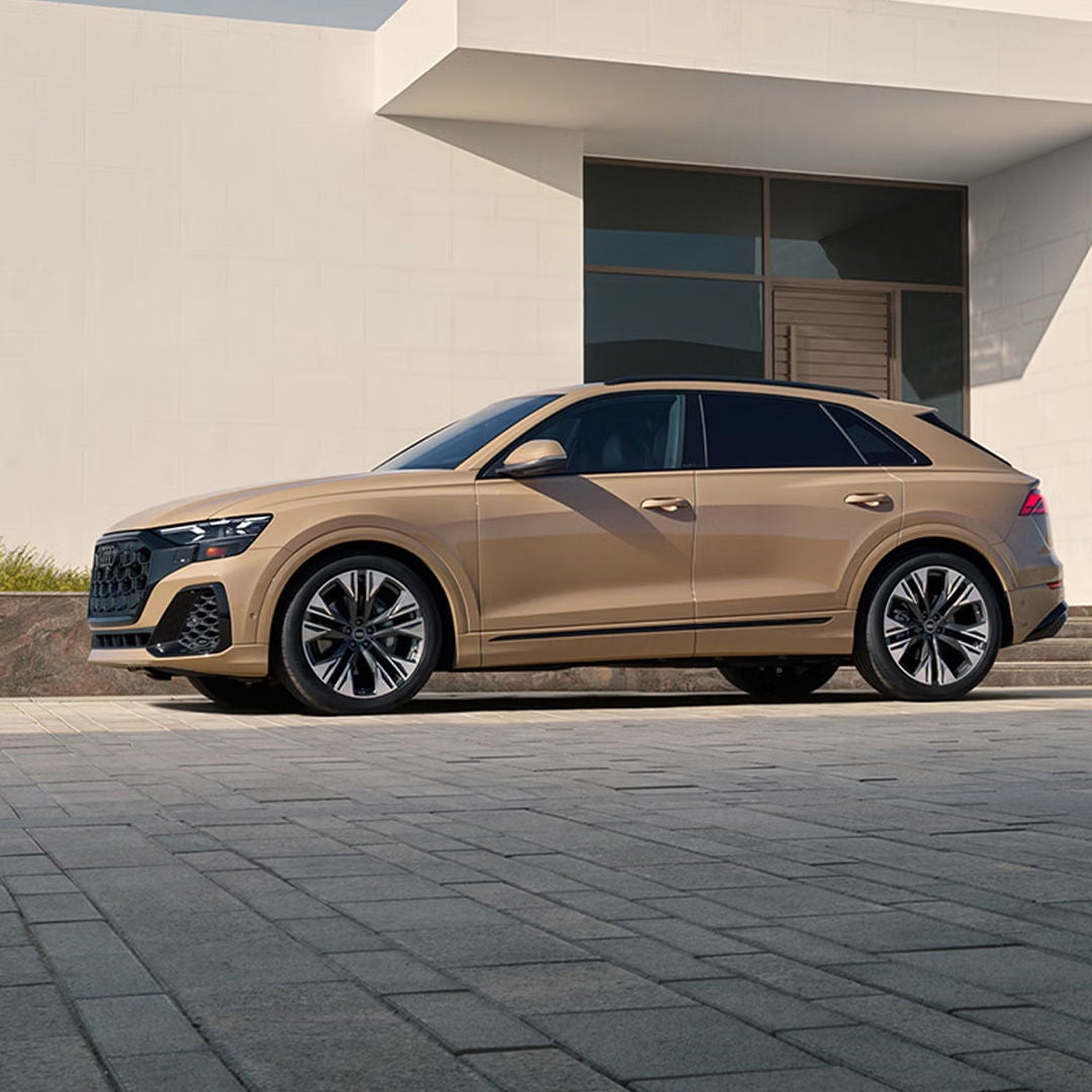 Side profile of the Audi Q8 parked.