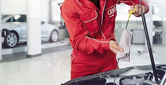 Service technicians changing oil.