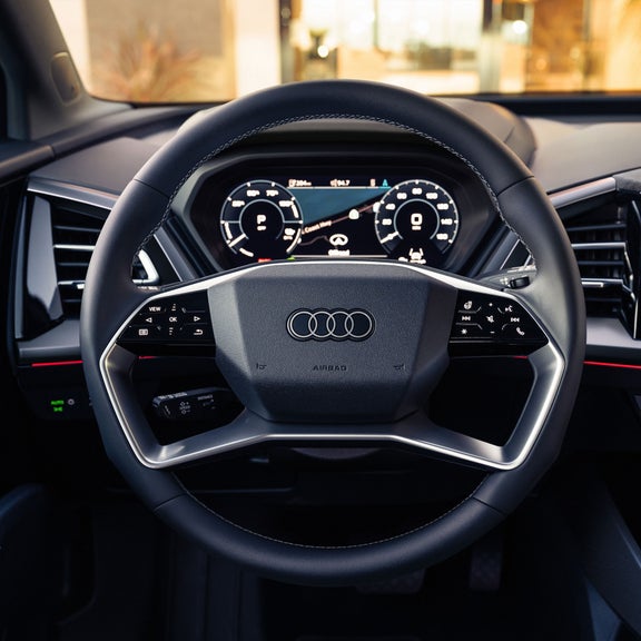 Close-up on the steering wheel of the Audi Q4 e-tron.