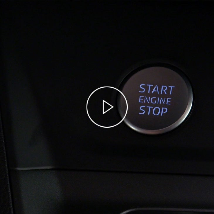  Close-up photo of the start/ stop button inside an Audi vehicle. 