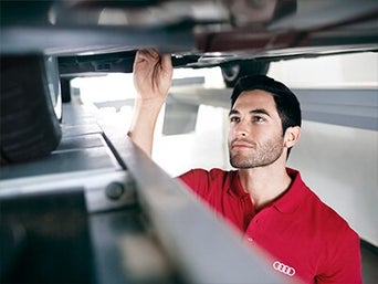 Service technician servicing air filter.