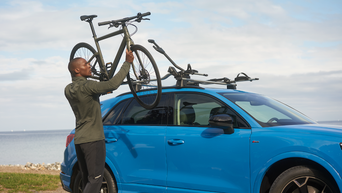 Service technician serving vehicle.