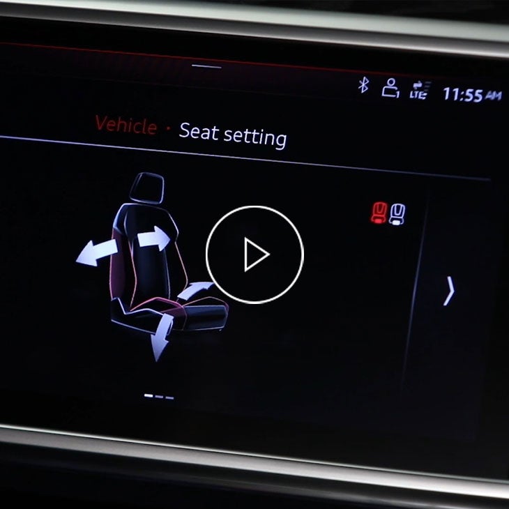  Close-up on the MMI screen in an Audi vehicle displaying the front seat adjustment options.
