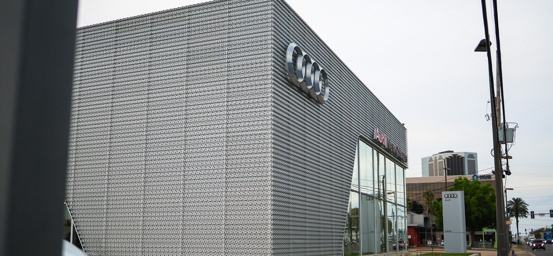 Two people chatting with each other across the charging station.