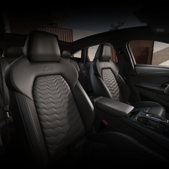 Interior view of the Audi S6 e-tron, showing the front sport seats.
