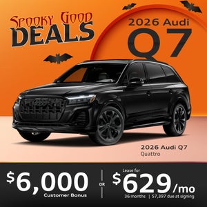 Side view of an Audi Q7 driving.