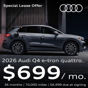 Gray Audi Q4 e-tron plugged in