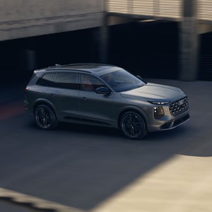 Aerial side view of the Audi SQ7 in motion.