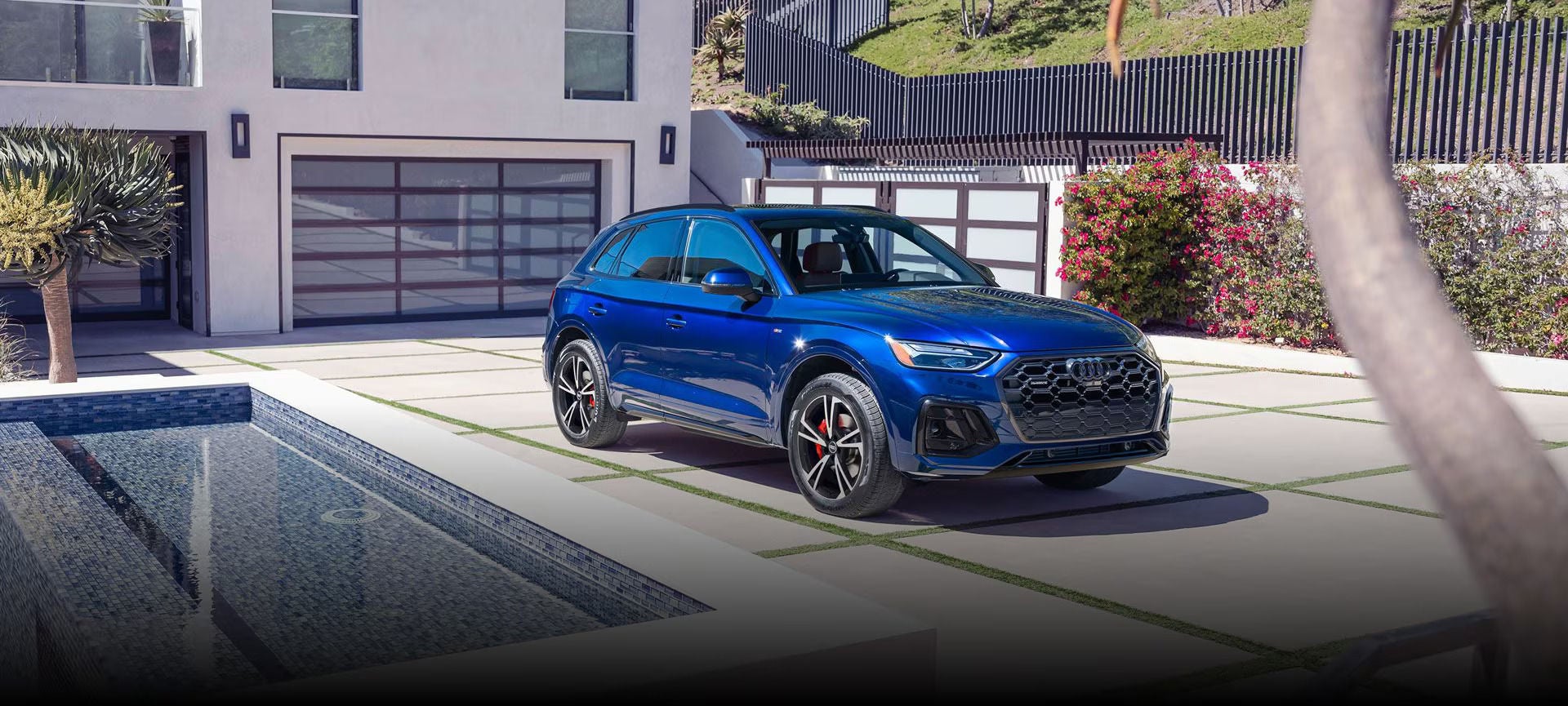 Left side profile view of an Audi S6 parked.
