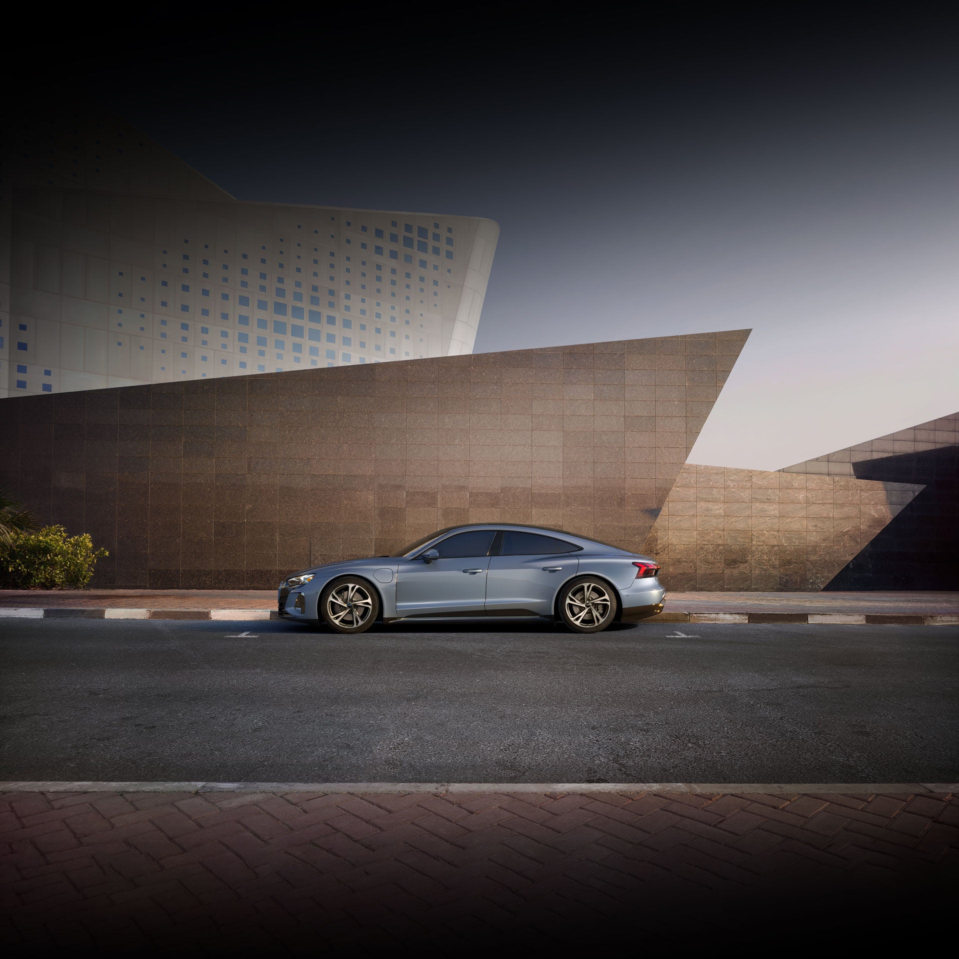 Side profile of a gray Audi e-tron GT.