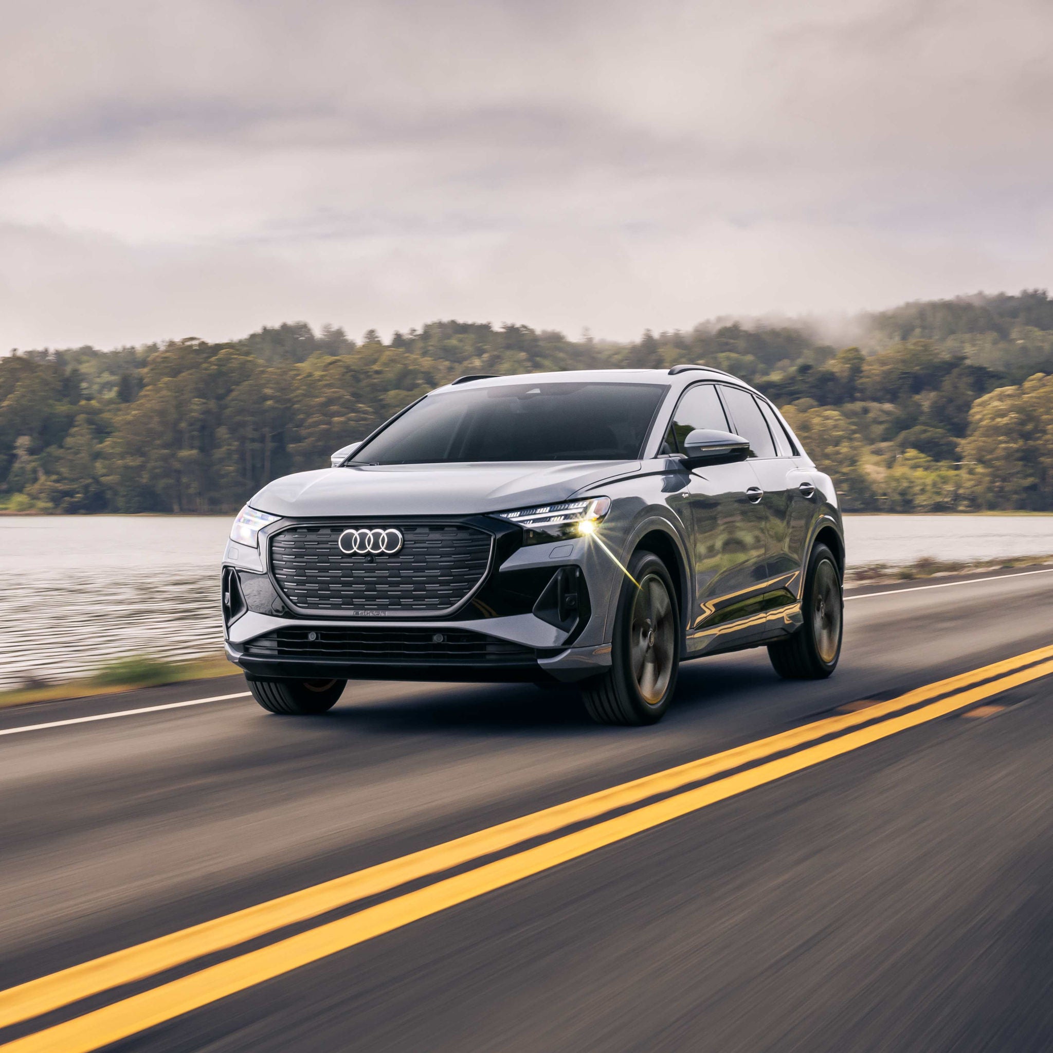 Front profile view of an Audi Q6 parked.