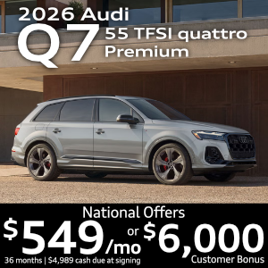 Side view of an Audi Q7 driving.