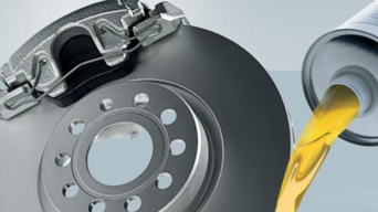 Service technician servicing tire.