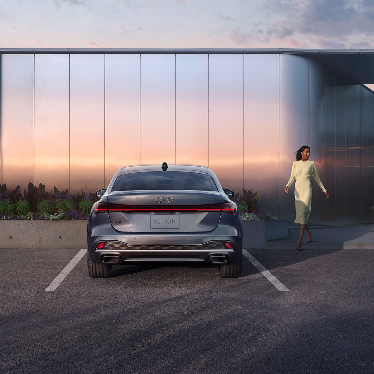 Three quarter view of an Audi parked.