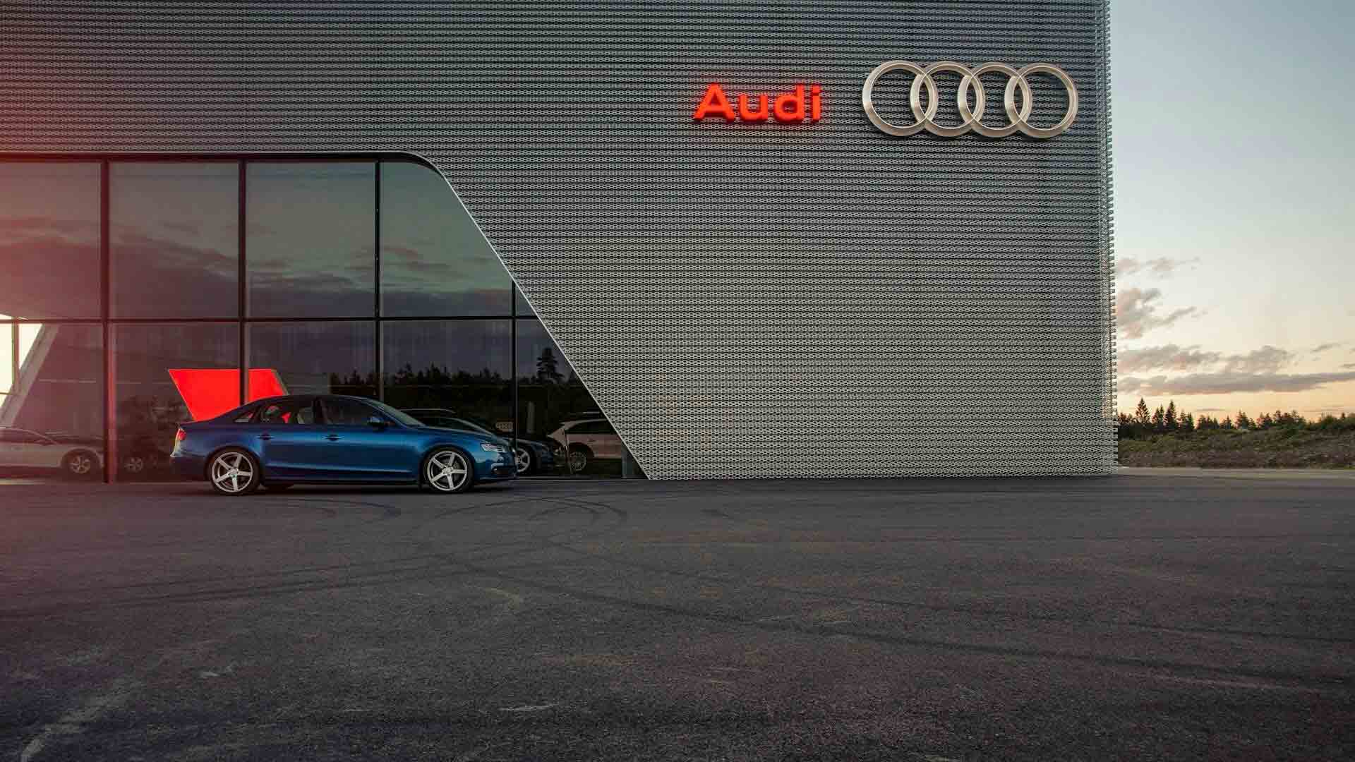Side view of parked Audi vehicle. 