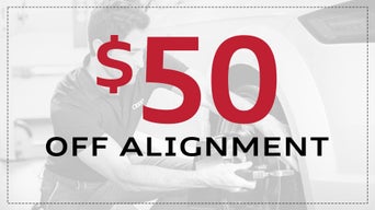 Service technician servicing vehicle. 