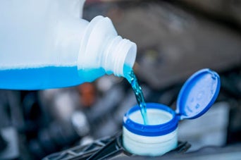 Washer fluid being refilled. 