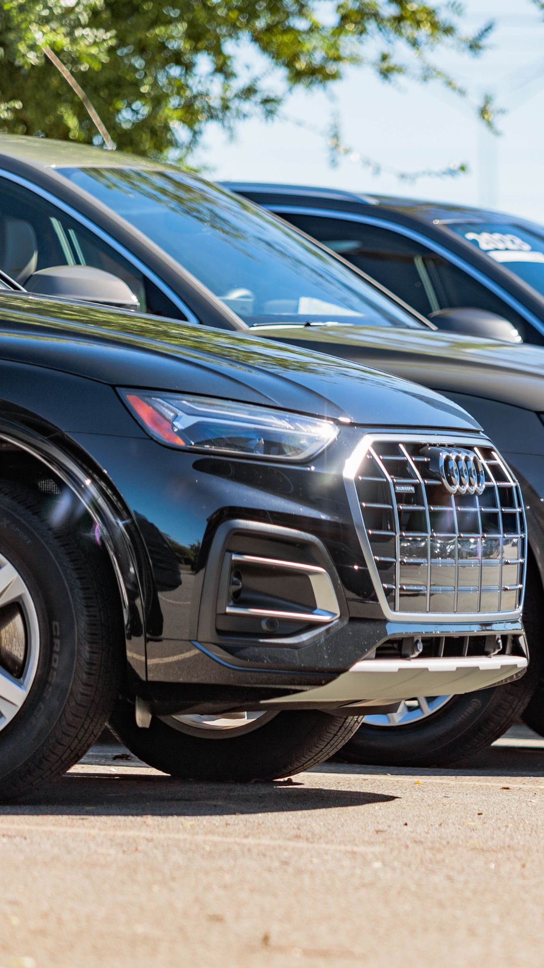 Three quarter view of an Audi parked.