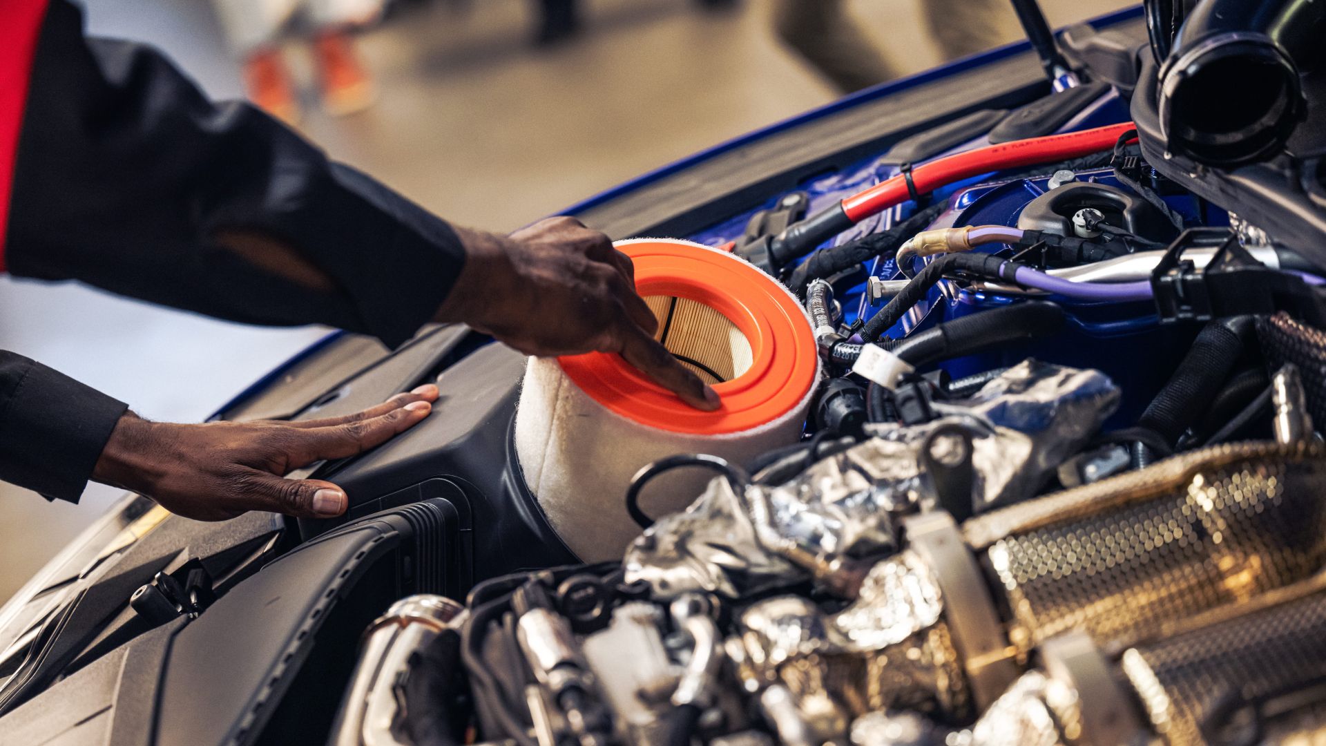 Audi technician working on a vehicle