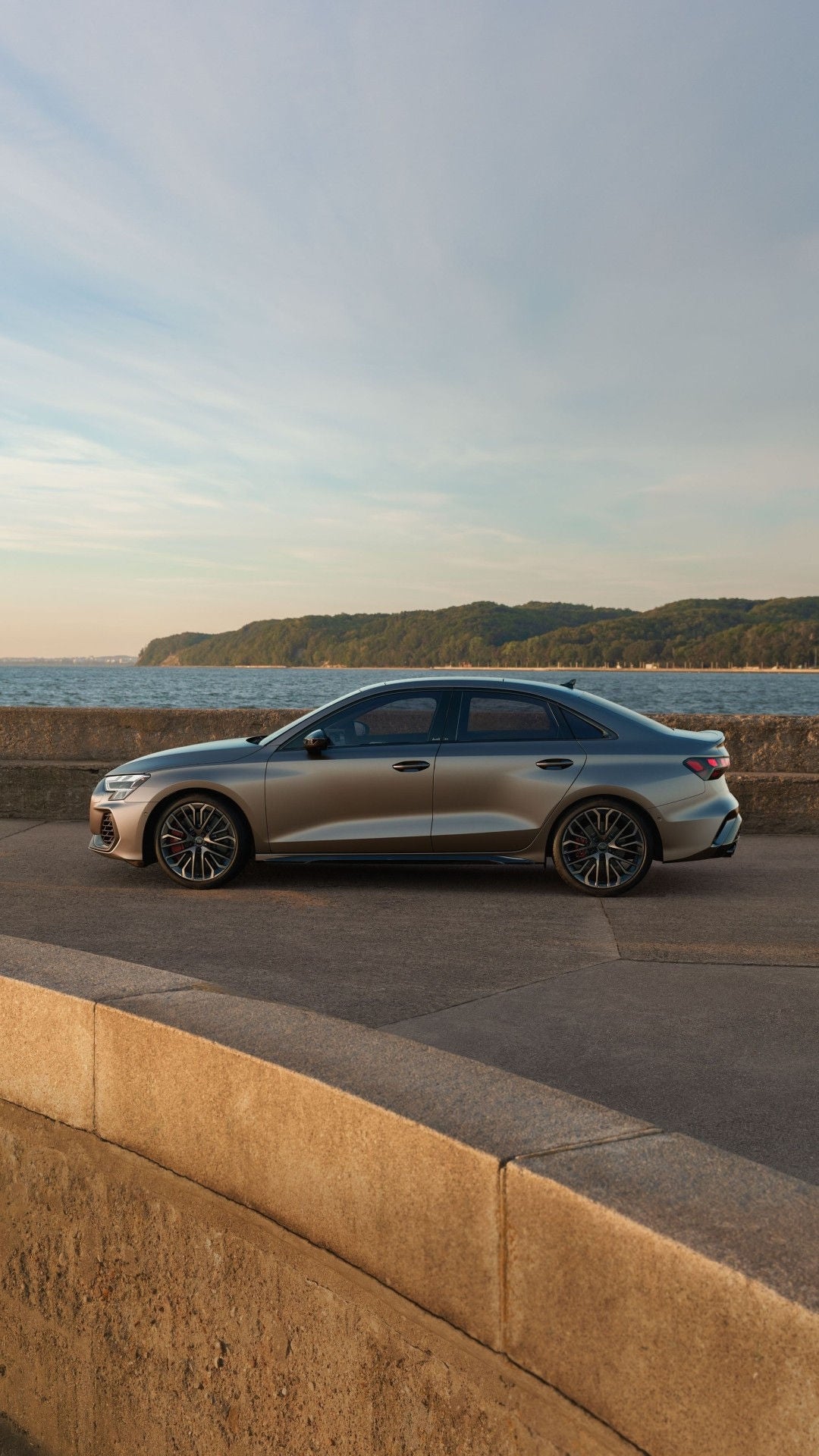 Side view of the Audi S3 parked by the waterfront.