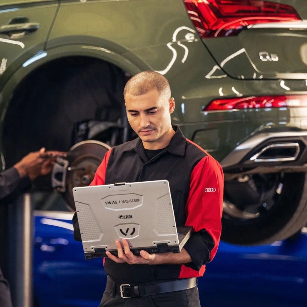 Audi technician observing a laptop.