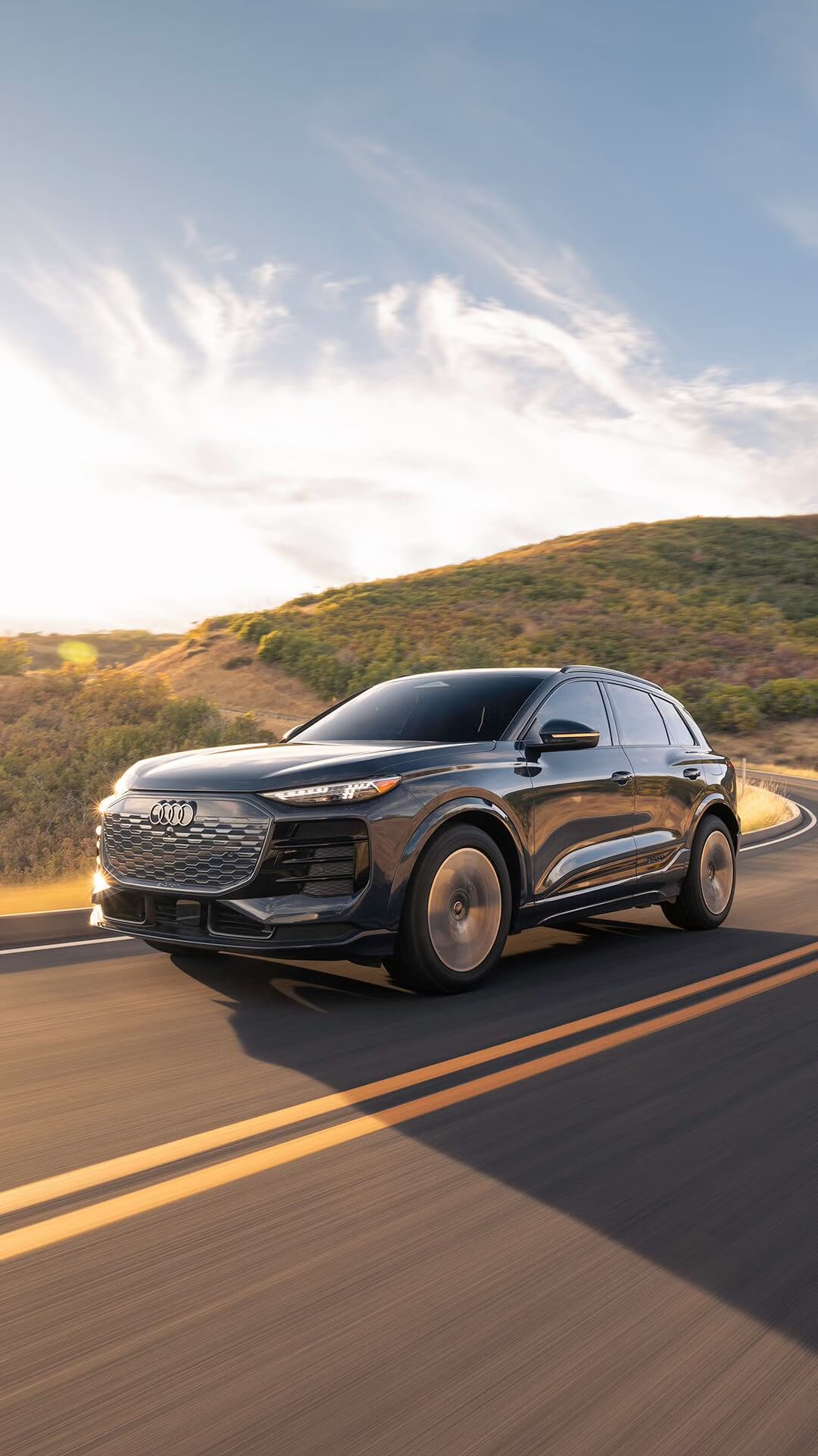 Audi Q6 e-tron driving down the road